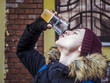 © Mihail - homeless man drinking frozen ice beer outside in the street