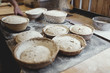 © Maskot - Close-up of fresh baked food in wicker basket on table at bakery
