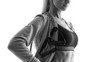 © USM Photography - Close up black and white photo of female fitness model Resistance Band Arms Abs Workout Attractive woman athlete in sportswear standing with resistance band