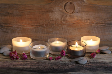 Wall Mural - Burning candles on weathered wood