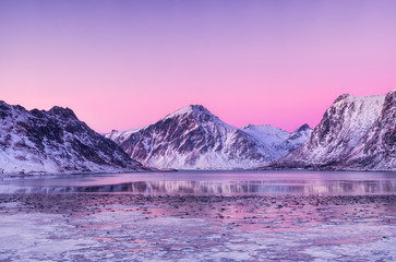 Wall Mural - Mountain ridge and reflection in the lake. Natural landscape in the Norway