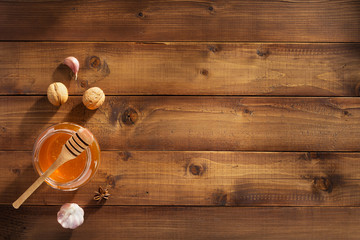 Wall Mural - glass jar of honey on wood