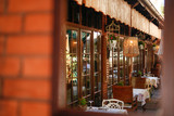 Fototapeta Psy - Terrace restaurant, setting tables outside