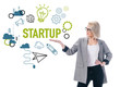 © LIGHTFIELD STUDIOS - beautiful stylish businesswoman presenting startup icons, isolated on white