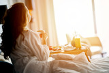 Fototapeta  - Breakfast in bed, cozy hotel room