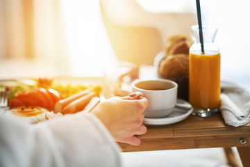 Breakfast in bed, cozy hotel room