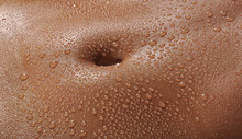Bodyscape Of A Nude Wet Belly