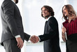 © ASDF - Young businessman shaking hands after agree to collaborate.