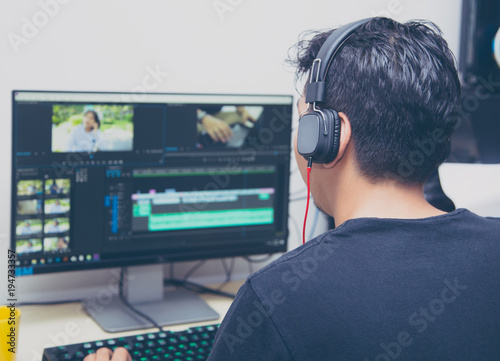 Cuadros en Lienzo back view of video editor using computer