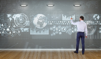 Poster - Businessman using graph screens interface on a wall 3D rendering