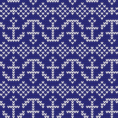  Knitted pattern of white anchors on a blue background. The concept of love for a marine object. Handmade ornament. Seamless pattern. Vector illustration.
