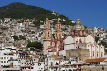 Daytime View Of Taxco De Alarcon, Mexico With Christ Ststue And Church Of Santa Prisca
