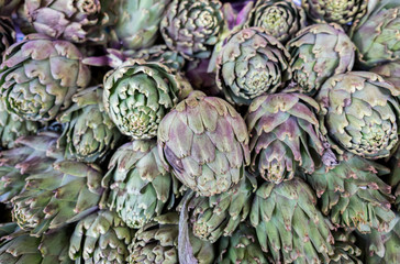 Wall Mural - big ripe artichokes for sale at local market