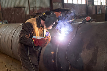 Wall Mural - Repair of parts of the apparatus for manual arc welding