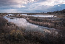 Reflection On The Frozen Pond At Dusk, Riverbend Ponds, Fort Collins, Colorado