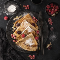 Sticker - crepes with  frozen berries and powdered sugar