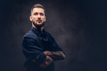 Studio portrait of a professional bearded butcher with hairstyle