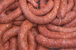 pile of raw sausages ready to cook or grill