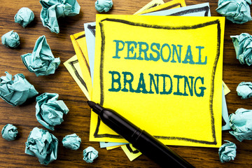 Poster - Handwritten text showing Personal Branding. Business concept for Brand Building Written on sticky note paper, wooden background with marker folded yellow paper meaning thinking