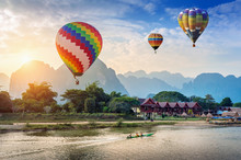 Hot Air Balloon Over Nam Song River At Sunset In Vang Vieng, Laos.