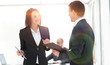 © ASDF - business colleagues discussing work issues at the office