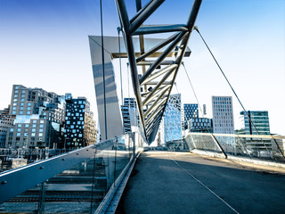 Beautiful different modern buildings,  bridge from Oslo's Barcode district rises from the fjord like an urban and super trendy in Norway. 22 November 2017, Oslo Norway