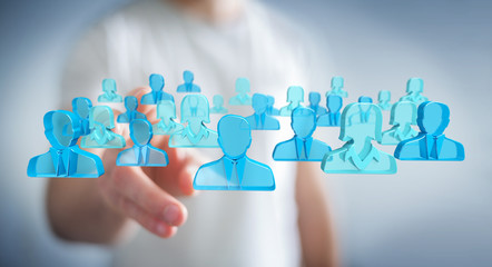 Aufkleber - Businessman holding 3D rendering group of blue people