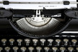 An old typewriter with the text What's your Story - so how is your story?