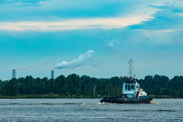 Canvas Print - Black tug ship underway