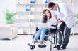 © Elnur - Disabled patient on wheelchair visiting doctor for regular check