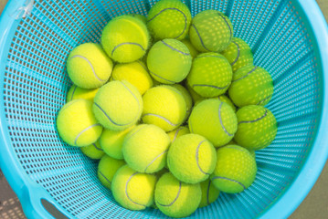 Tennis ball in a basket of blue.