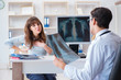 © Elnur - Young woman visiting radiologist for x-ray exam