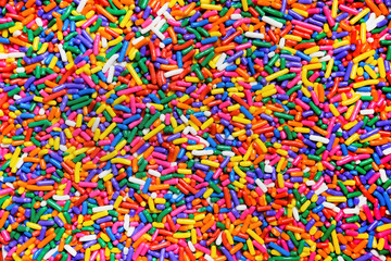 Rainbow sprinkles close up background