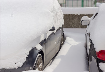 Fragment of the side parts of the two snowbound cars