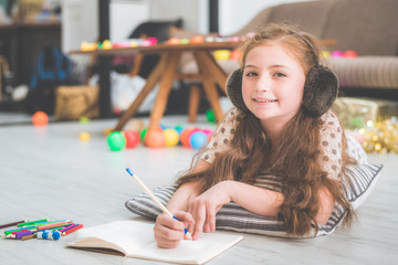 little cute girl studying and reading book at home, education concept 