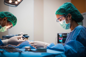 team of surgeons working in the operating room, medical concept 