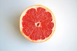 Juicy grapefruit half isolated on white background close up