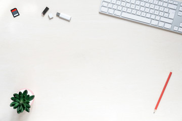Wall Mural - copy space on white desk background with keyboard, usb sticks and sd memory card