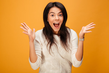 Canvas Print - Portrait of a cheerful young woman celebrating success