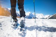 Walk With Snowshoes In The Snow During Mountain Holidays