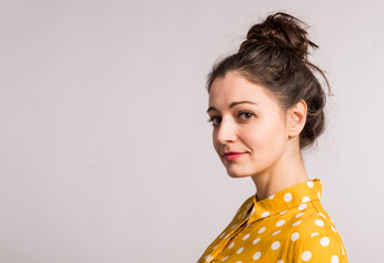 Portrait of a young beautiful woman in studio.