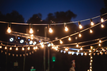 a garland of light bulbs in the decoration of the night ceremony