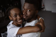 © LIGHTFIELD STUDIOS - beautiful young african american couple hugging and smiling at camera