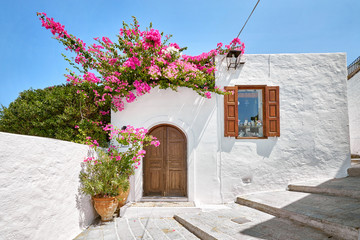 Facade of traditional white house in Lindos town at Rhodes island