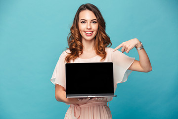 Wall Mural - Portrait of a happy beautiful girl wearing dress