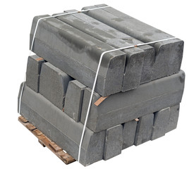 Wall Mural - The pallet with a stack of concrete curbstone on white