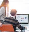 © ASDF - employees analyzing the marketing graphics