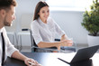 © Africa Studio - Young woman in wheelchair with colleague at workplace
