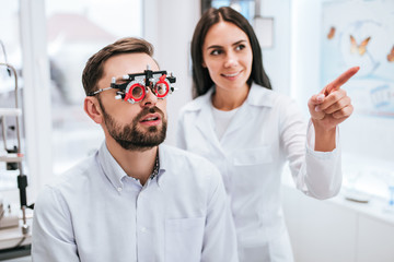 Wall Mural - Doctor and patient in ophthalmology clinic