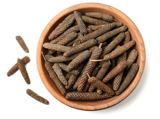 Wall Mural - dried long pepper, piper longum isolated on white, top view